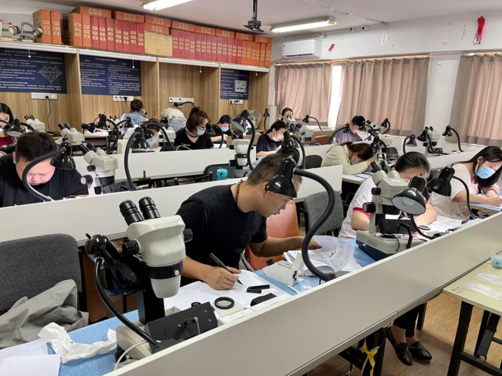 Asian students of gemmology in their classroom