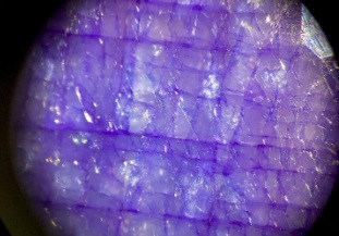 dyed gemstone in ourple with colour concentrations