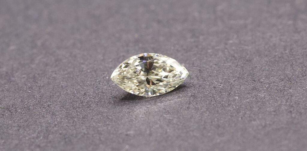 A poorly cut marquise diamond showcases the bow-tie effect (a dark area across the centre of the stone), "bow tie" shape
